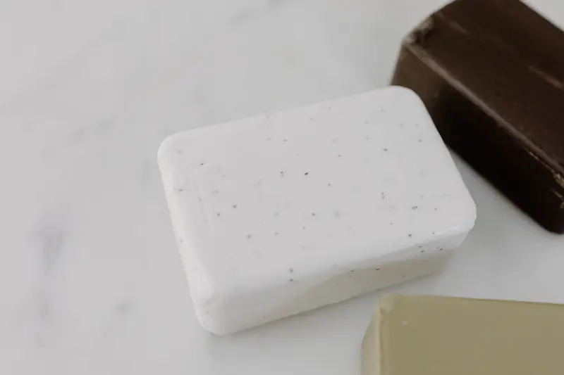 Close-up view of assorted soap bars on a marble surface, highlighting natural skincare routines