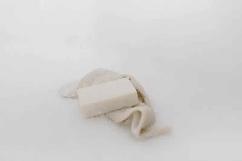 A bar of soap on fabric creating a calming and clean aesthetic