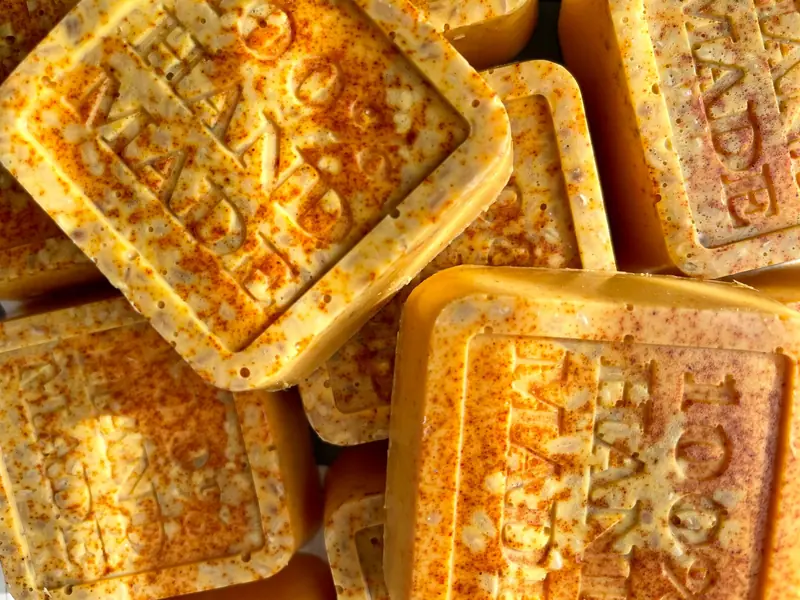Close-up of beautifully crafted handmade soap bars showcasing natural textures and vibrant hues
