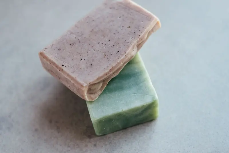 Close-up of two organic handmade soap bars, showcasing natural textures and colors